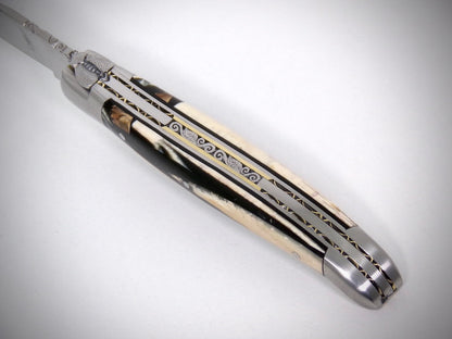 Laguiole Ivoire de Mammouth stabilisé ciselé par David DAUVILLAIRE