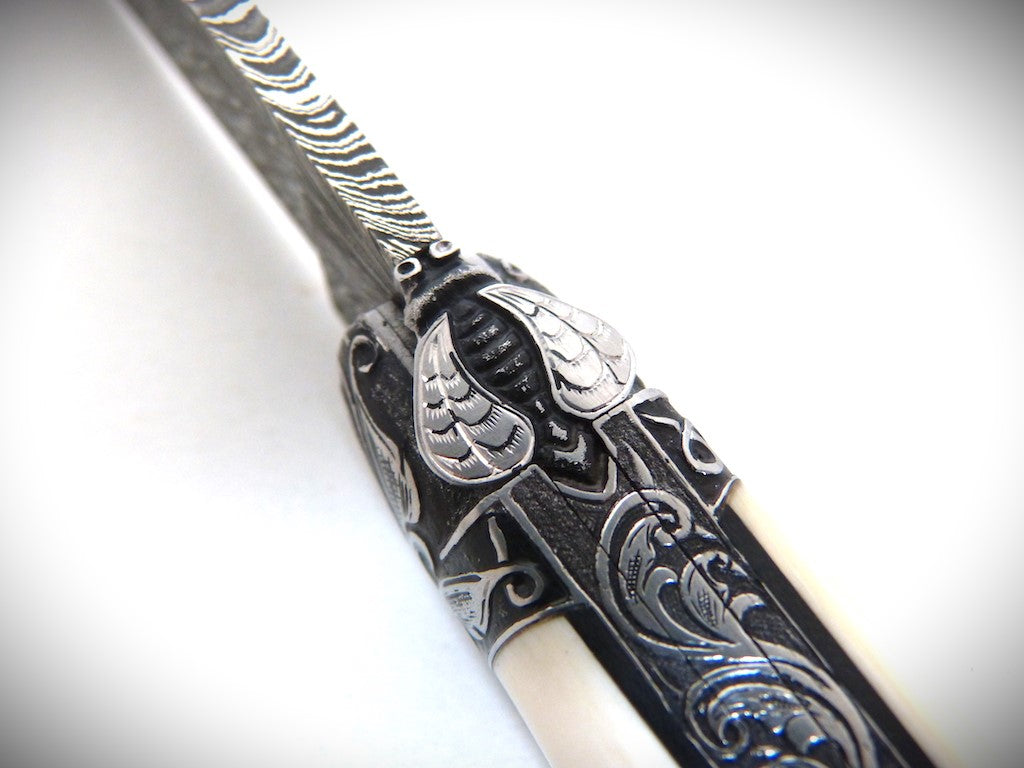 Laguiole "Acanthus" Mammoth Ivory, engraved bolsters, Damascus feather blade