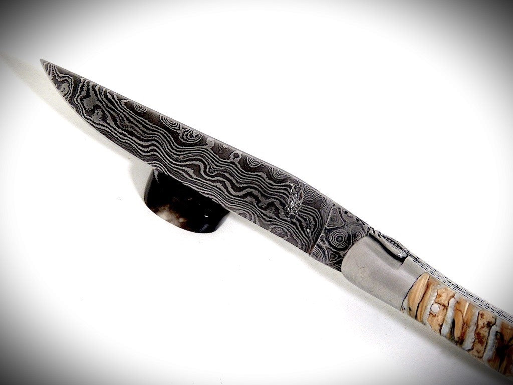 Laguiole Mammoth Molar, laminated Damascus blade chiseled by David DAUVILLAIRE