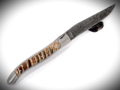 Laguiole Mammoth Molar, laminated Damascus blade chiseled by David DAUVILLAIRE