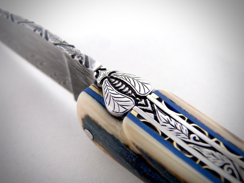 Laguiole Blue Mammoth Ivory Crust, Damascus Plume blade chiseled by David DAUVILLAIRE