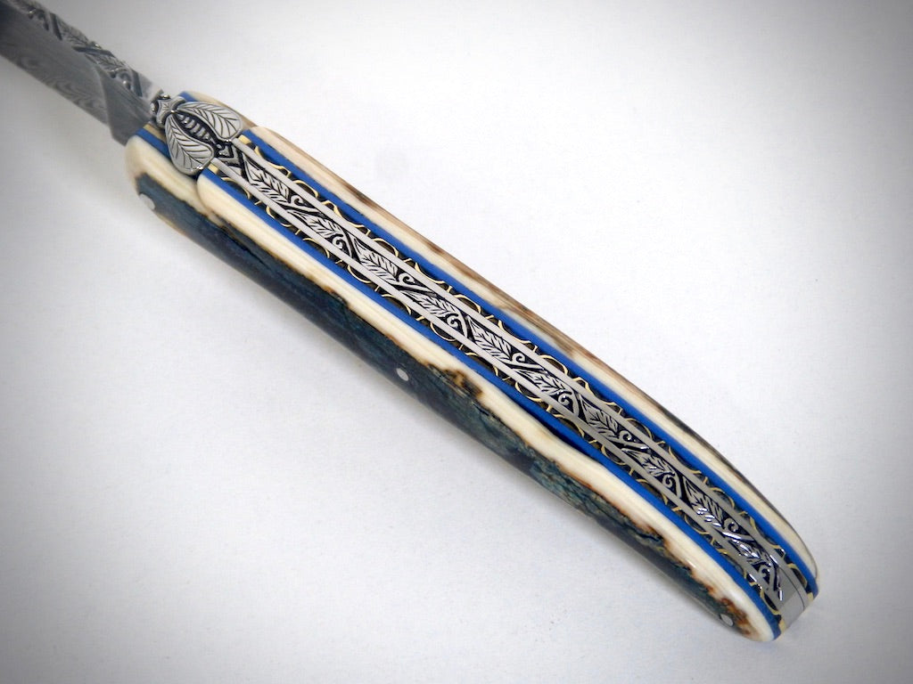 Laguiole Blue Mammoth Ivory Crust, Damascus Plume blade chiseled by David DAUVILLAIRE